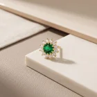 Rhea Small Lab Emerald 18K gold threadless top, close-up of the lab emerald and halo