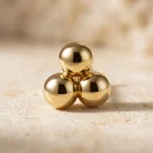 Tria 18K yellow gold tri-bead threadless top, close-up